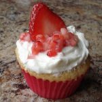 Vanilla Cupcake, White Chocolate Cream Cheese Frosting, Strawberries on Top!