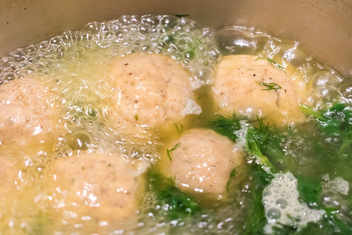 matzo balls in boiling broth.