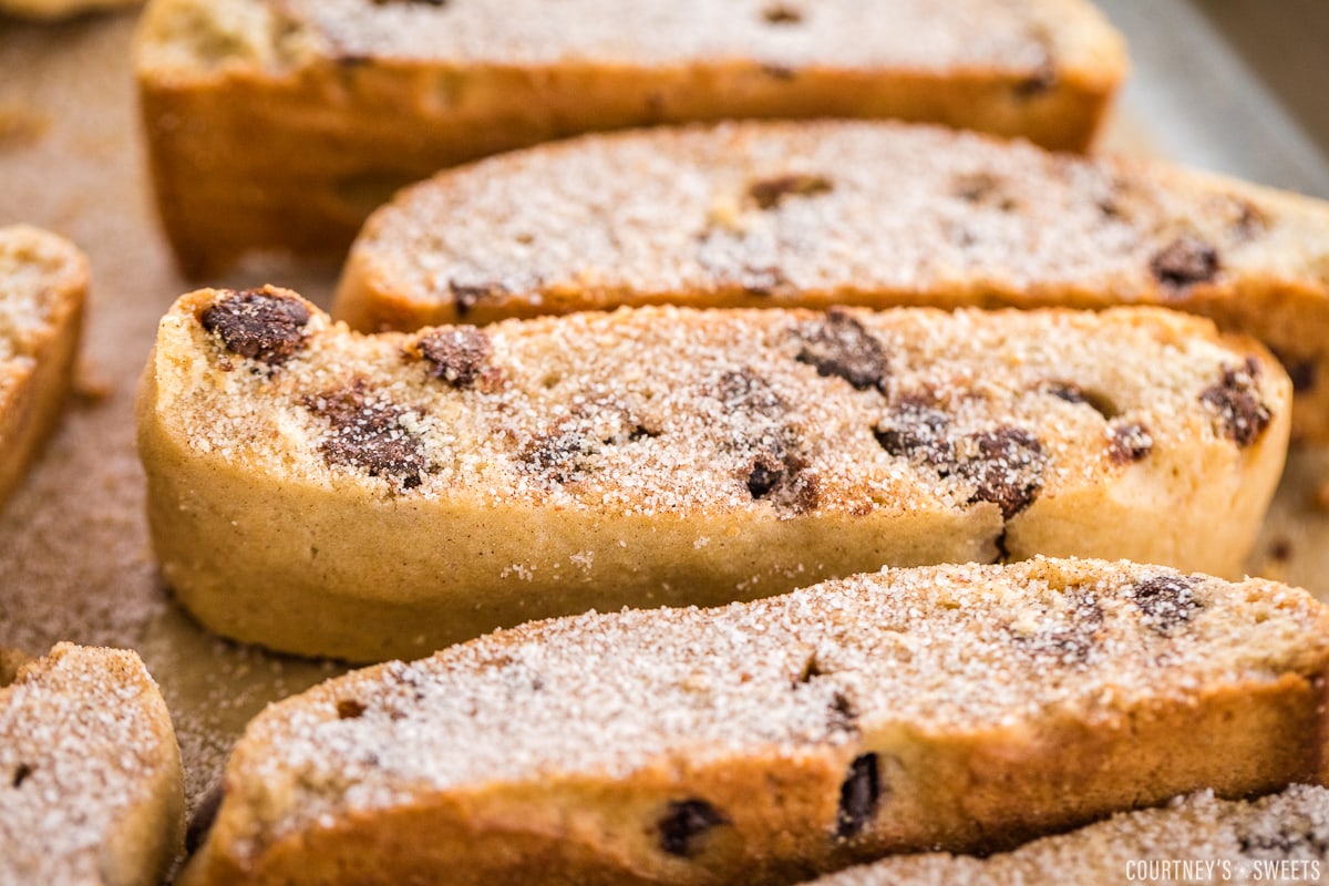 close up of cinnamon sugar on mandel bread on a baking sheet