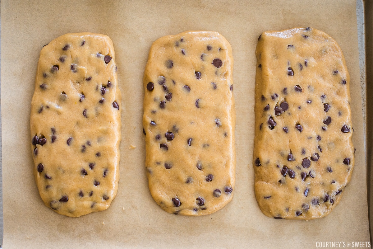 three raw loaves of mandel bread on a baking