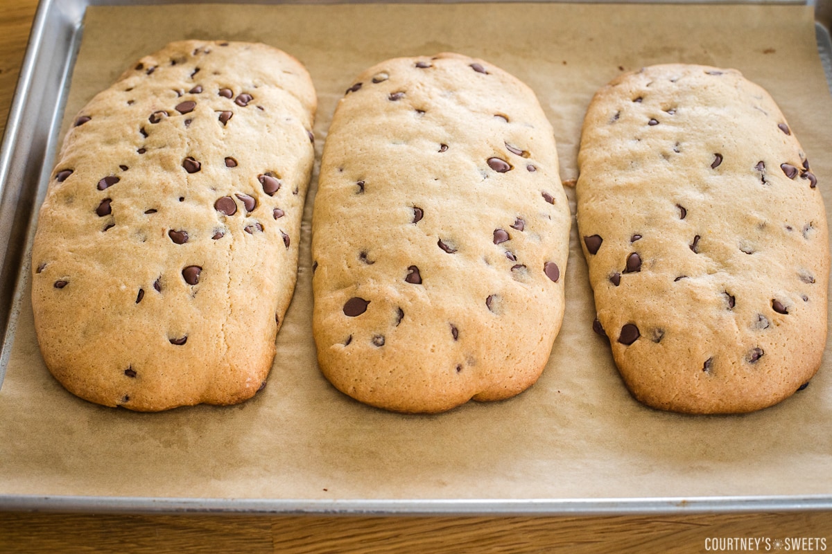 three loaves of mandel bread on a baking sheet