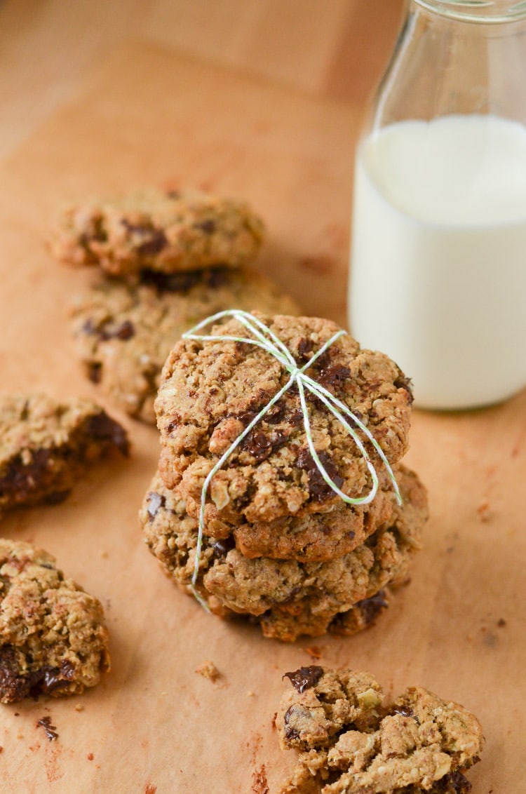 lactation cookies stacked tied with ribbon and glass with milk