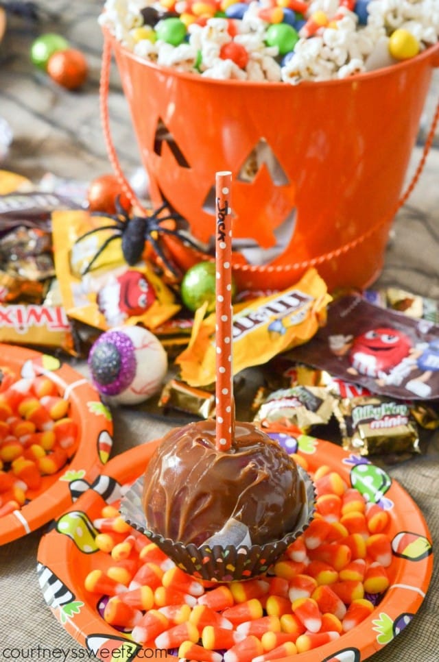 Haunted Halloween Party with Caramel Apple Place Cards and tons of candy, spider web pizza with olive spiders and more. Make a BOO Kit for your guests or let them make their own!