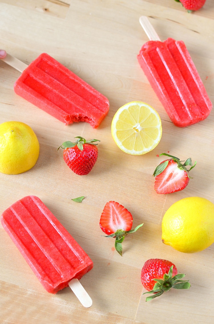 Healthy Strawberry Lemonade Popsicles! Trying to make healthy food and healthy desserts at home? Our Strawberry Lemonade Ice Pops are the perfect dessert to keep your family on the healthy lifestyle path. Strawberry Lemonade Popsicles