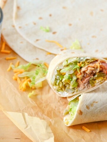 Our Chicken Burrito Recipe is super easy to make and it's so delicious. Make a perfect dinner in less than an hour. Super budget friendly meal and you can have leftovers for days by bulking up with other ingredients.