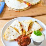 Chicken Quesadillas Recipe - Super easy restaurant style quesadillas made at home. We bake them in the oven to make them a bit of a healthier option, no frying in a pan! Kid friendly recipe on Mini Chef Mondays
