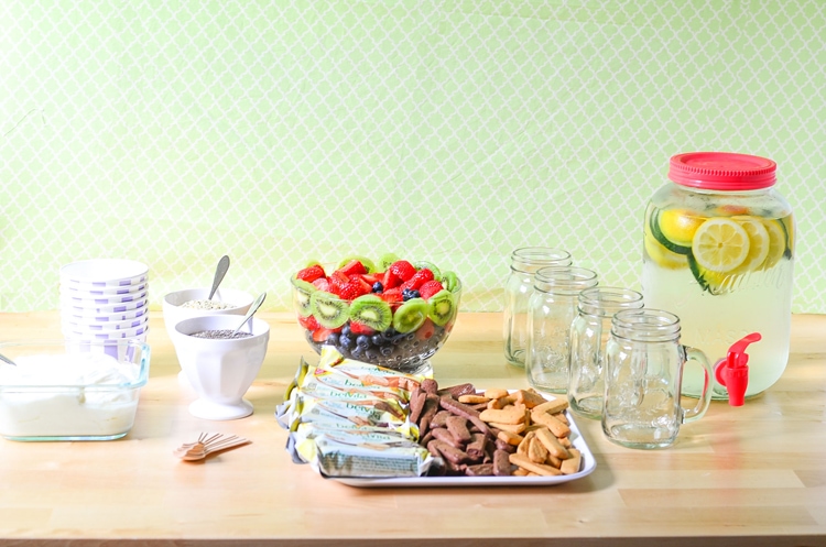 Easy Breakfast Party - Well balanced breakfast. Yogurt Bowls with fresh fruit, breakfast biscuits, dippers, cucumber lemon water and gifts to go!