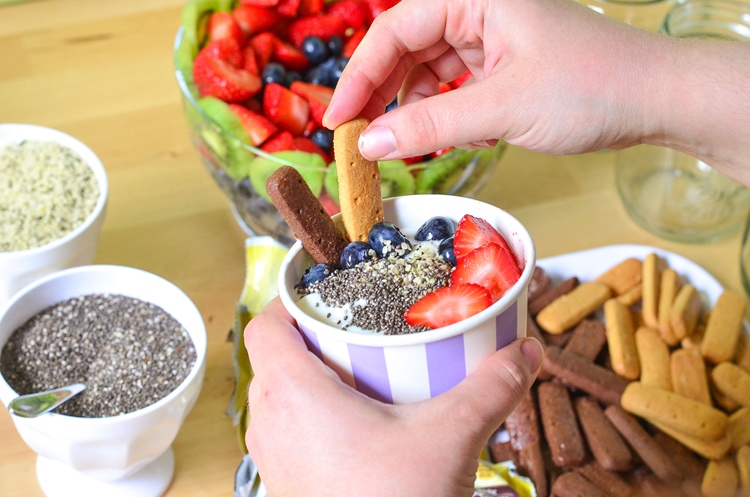 Easy Breakfast Party - Well balanced breakfast. Yogurt Bowls with fresh fruit, breakfast biscuits, dippers, cucumber lemon water and gifts to go!