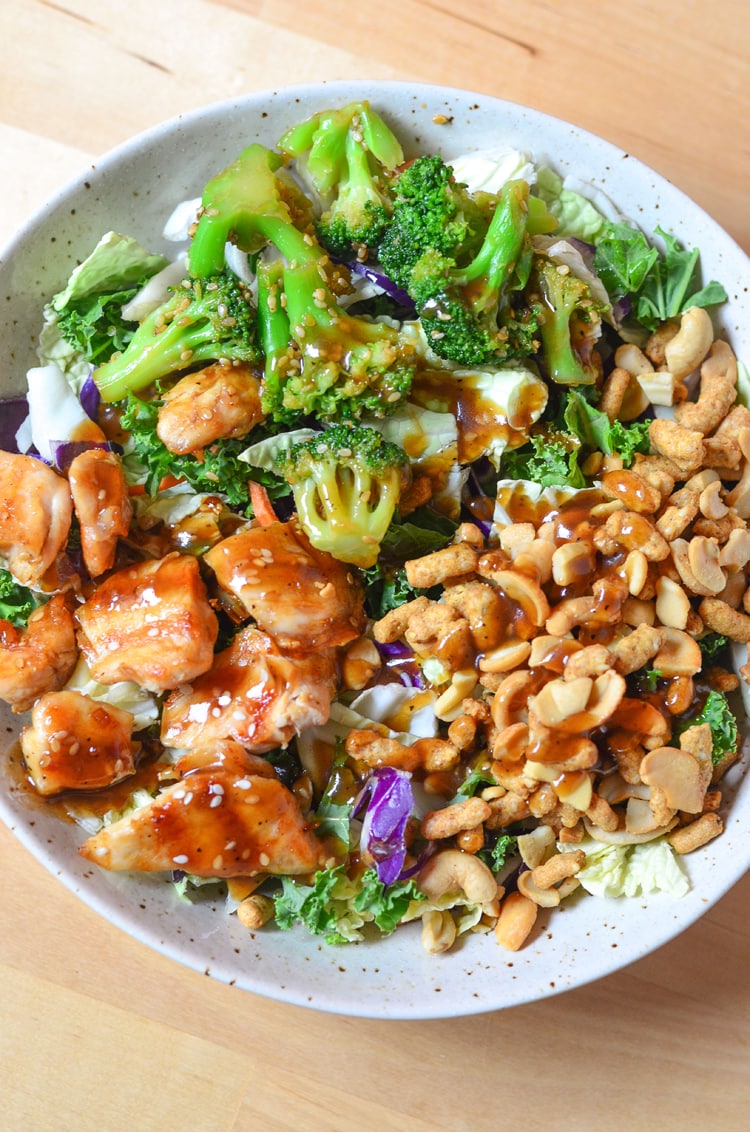 Asian Sesame Chicken Salad - a quick healthy a simple recipe for the entire family to enjoy. Filling meal and full of nuts, chicken, broccoli and beautiful, nutritious greens!