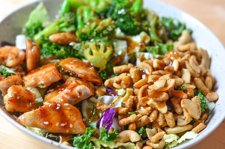 Asian Sesame Chicken Salad - a quick healthy a simple recipe for the entire family to enjoy. Filling meal and full of nuts, chicken, broccoli and beautiful, nutritious greens!