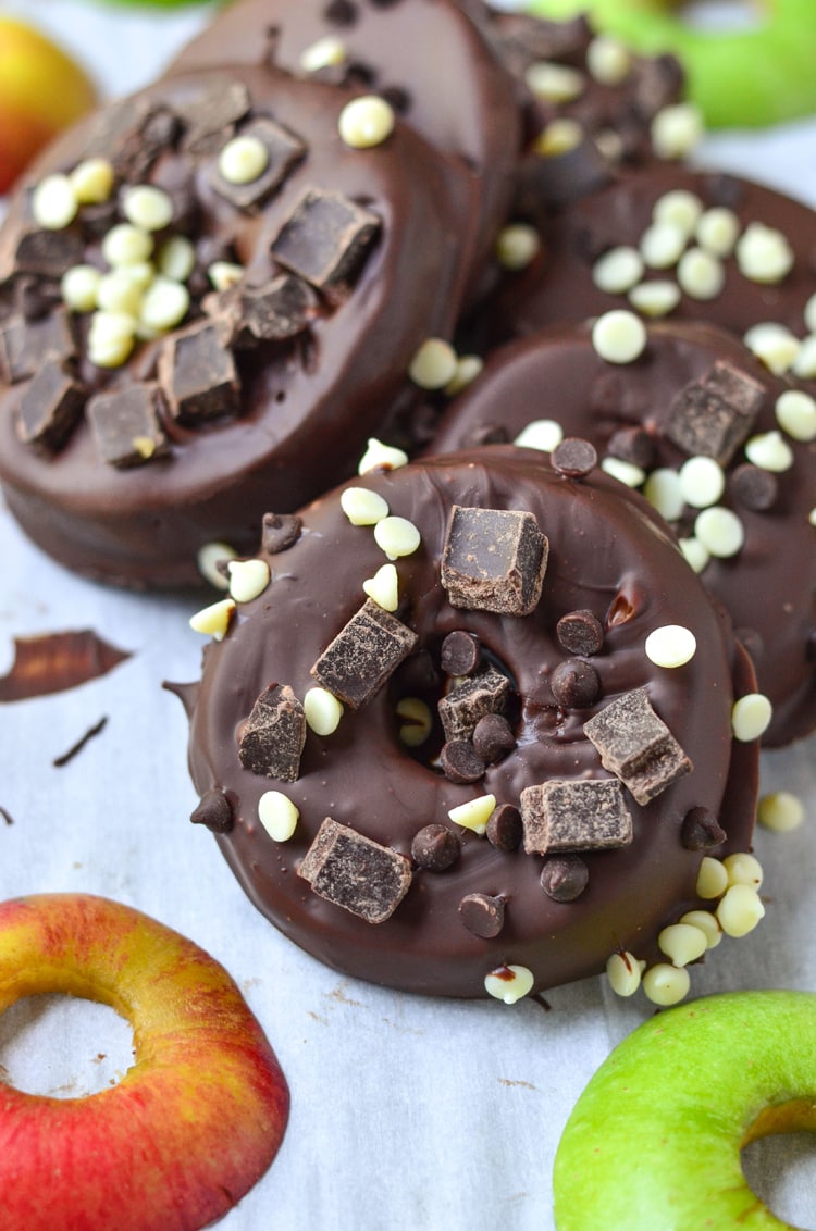 Try our delicious and healthy no bake fall treat; chocolate covered apple donuts! Freshly picked crisp apples that we covered in triple chocolate. It's a fun, healthy snack for the fall season when you pick apples. Serve to guests and wow them for sure, plus it's easy for your mini chef to help make them. :) They're a great vegetarian option so everyone can enjoy. You could even make them raw vegan treats if you choose vegan toppings.