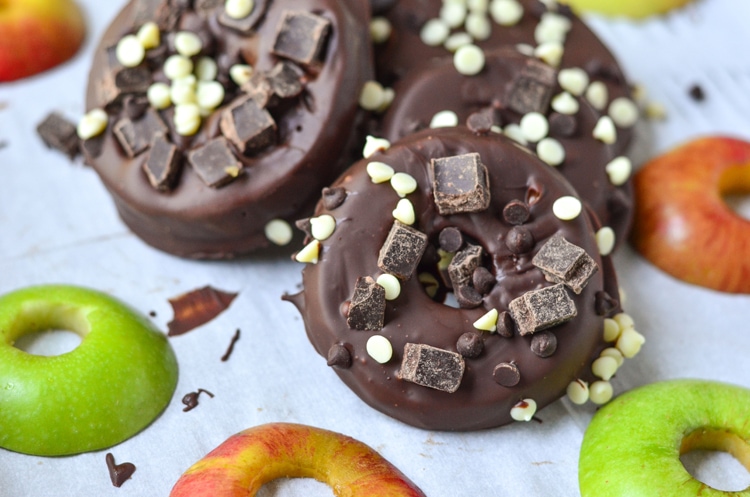 Try our delicious and healthy no bake fall treat; chocolate covered apple donuts! Freshly picked crisp apples that we covered in triple chocolate. It's a fun, healthy snack for the fall season when you pick apples. Serve to guests and wow them for sure, plus it's easy for your mini chef to help make them. :) They're a great vegetarian option so everyone can enjoy. You could even make them raw vegan treats if you choose vegan toppings.