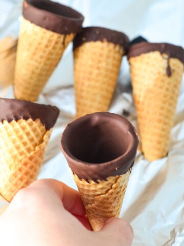 Save money and make your own Chocolate Filled Ice Cream Cones just like those ice cream cones you find in the freezer section! Delicious chocolate filled sugar cones for homemade ice cream. Such a simple recipe!!