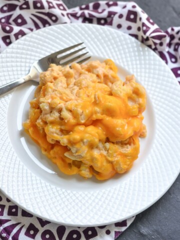 Crock-Pot® Slow Cooker Mac and Cheese that you can make by just dumping all the ingredients right in! This is a raw uncooked noodles recipe too! Great comforting fall recipe for entertaining.