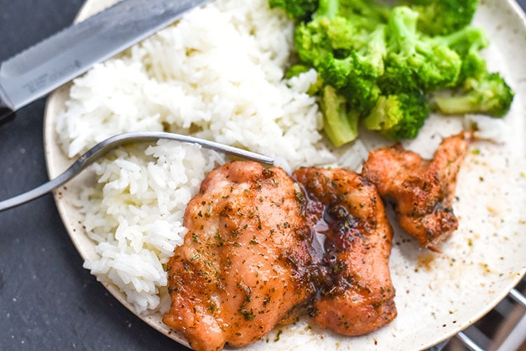 This sweet baked boneless chicken thighs recipe cooks up in less than 30 minutes! A chicken recipe that is loaded with flavor like sweetness, salty, and garlic! #chicken #chickenrecipes #dinner #chickenthighs