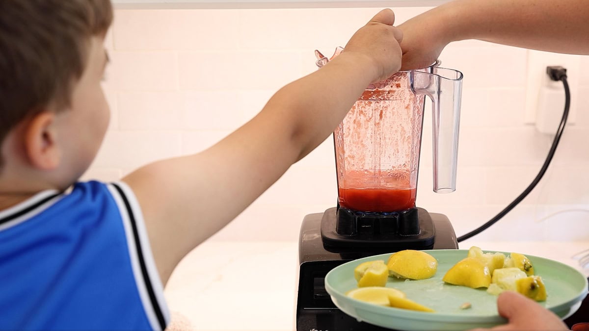 squeezing lemons into blender.