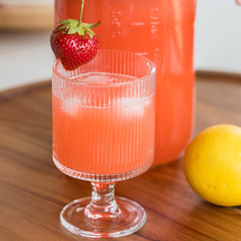 fresh strawberry lemonade in a glass with ice.