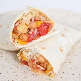 This healthy burrito recipe is not only filling, but it's also vegan! Filled with peppers, onions, chickpeas, seasoning and quinoa rice.