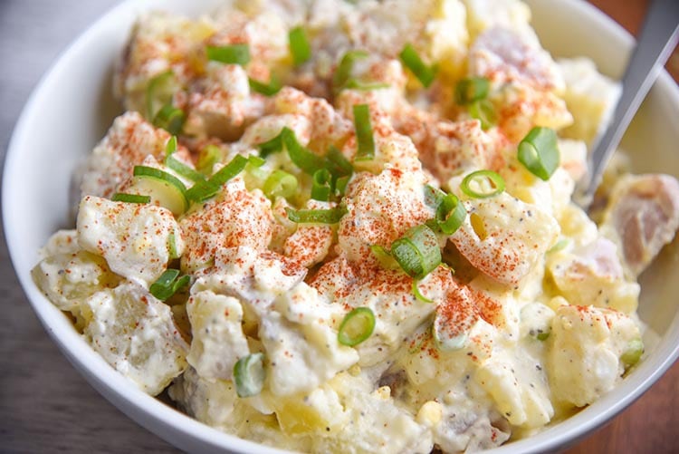 Quick and easy Potato Salad with Eggs Recipe is a great summer side dish for parties! Comfort food that is a family favorite for many!