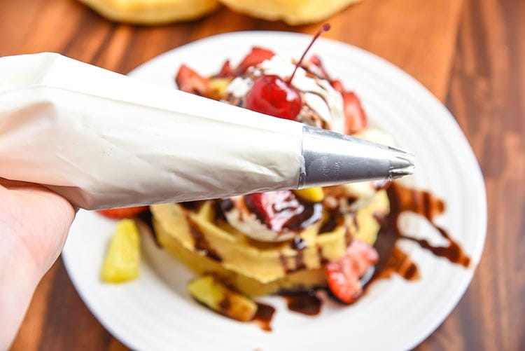 Banana Split Breakfasts are my absolute favorite. Especially this Banana Split Waffles Breakfast! Fun twist on a classic dessert recipe turned into a tasty breakfast recipe. greek yogurt