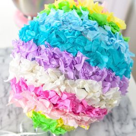 Have fun creating this DIY Pinata Easter Egg for a kid friendly Easter craft with your kids! This is a great DIY home tutorial or even a fun classroom activity.