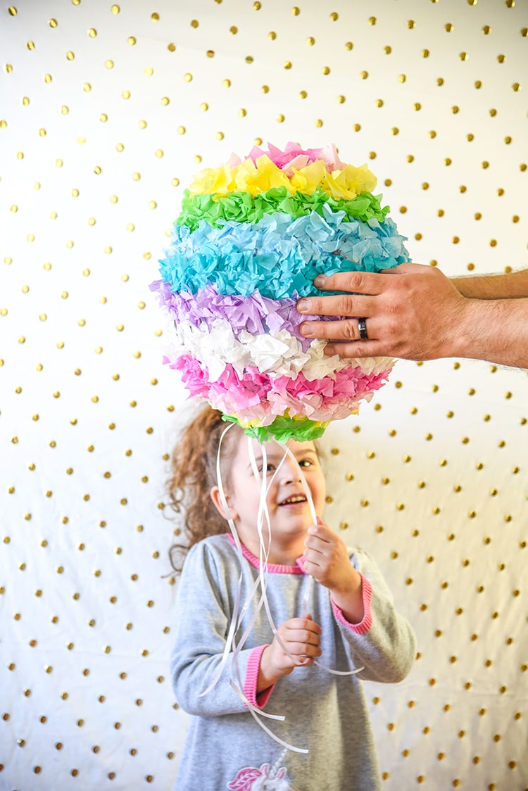 Have fun creating this DIY Pinata Easter Egg for a kid friendly Easter craft with your kids! This is a great DIY home tutorial or even a fun classroom activity.