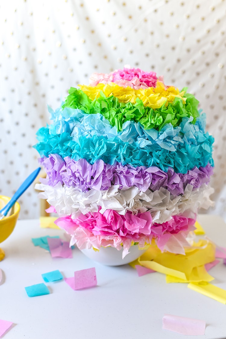 Have fun creating this DIY Pinata Easter Egg for a kid friendly Easter craft with your kids! This is a great DIY home tutorial or even a fun classroom activity.