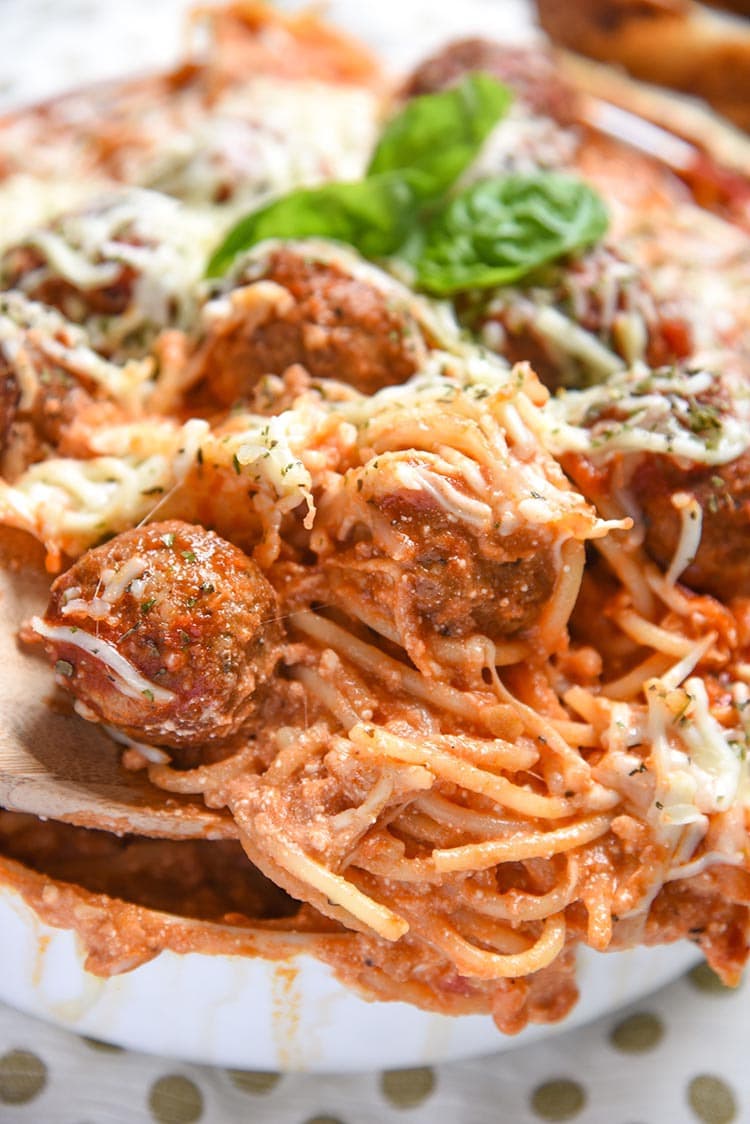 Baked Spaghetti and Meatballs is an easy dinner recipe of Italian Meatballs with Homemade Marinara Sauce, Pasta, Italian Cheese, and Spice.