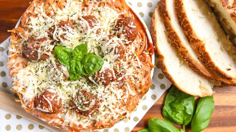 Baked Spaghetti and Meatballs is an easy dinner recipe of Italian Meatballs with Homemade Marinara Sauce, Pasta, Italian Cheese, and Spice.