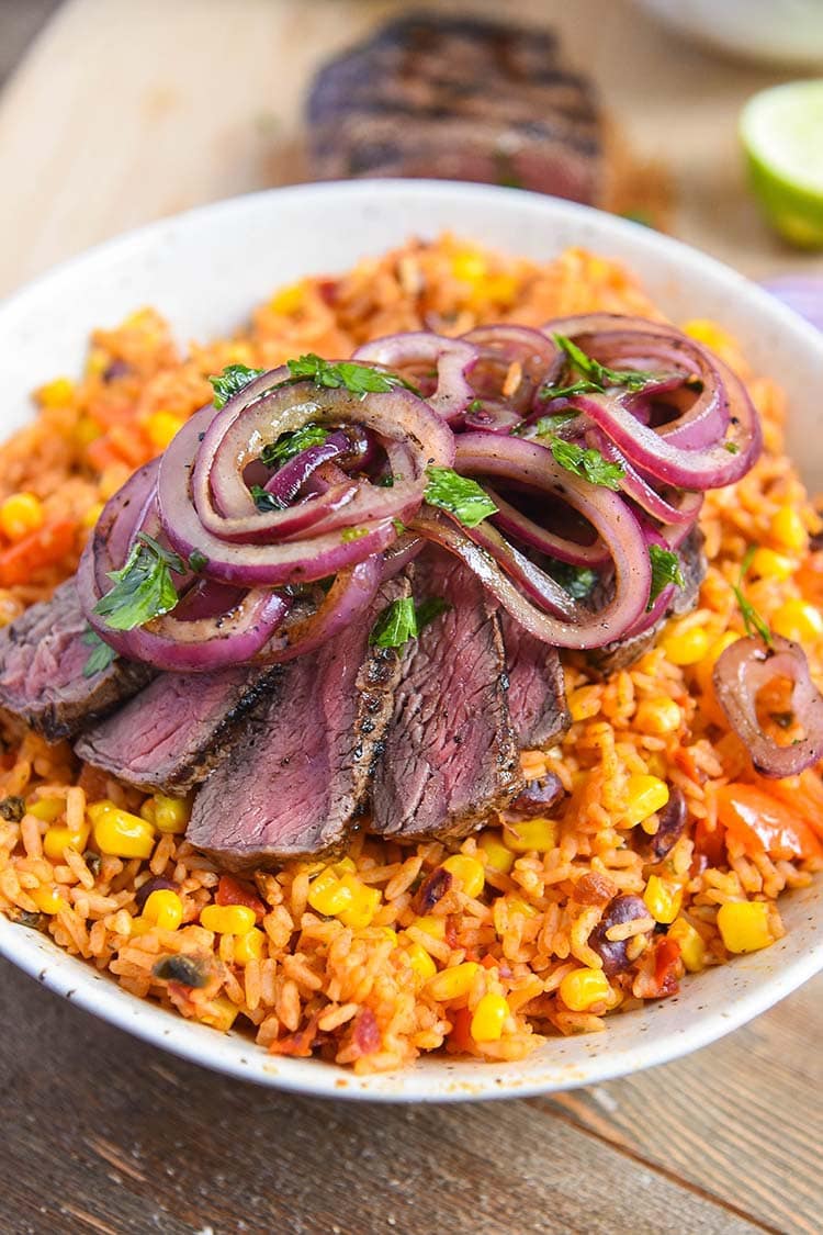 sizzling mexican steak recipe topped with onion relish