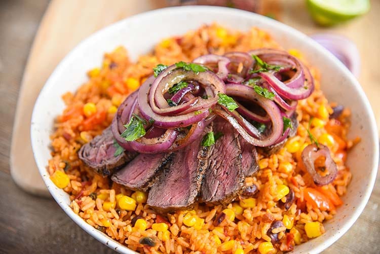 grilled steak with rice and beans