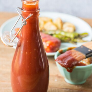 homemade bbq sauce with in open glass bottle