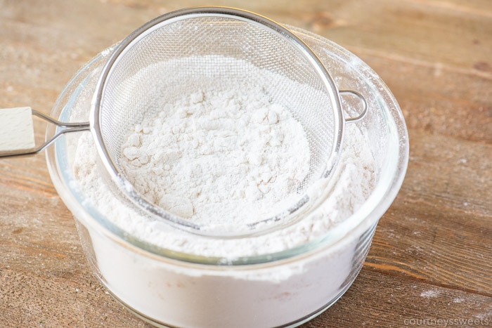 sifting flour for banana bundt cake