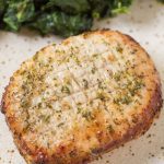 air fryer pork chops on a speckled plate