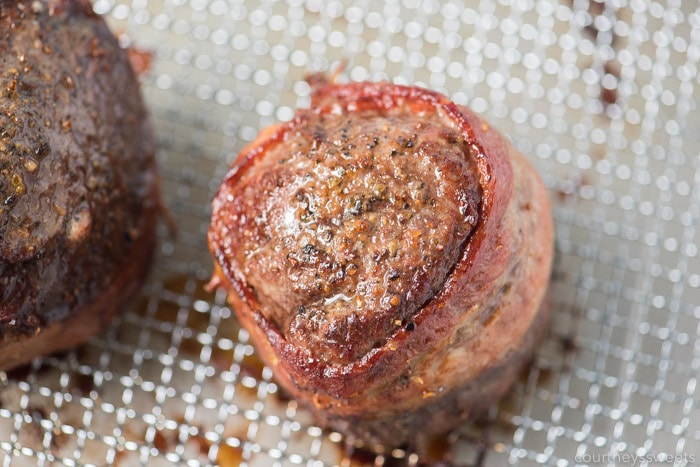 This bacon wrapped filet mignon will wow your dinner guests. Nicely seared on the outside with a beautiful pink inside on this air fryer filet mignon with bacon! how long to cook bacon wrapped filet mignon