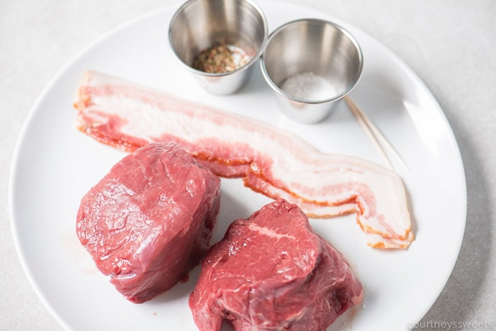 This bacon wrapped filet mignon will wow your dinner guests. Nicely seared on the outside with a beautiful pink inside on this air fryer filet mignon with bacon! bacon wrapped filet mignon ingredients