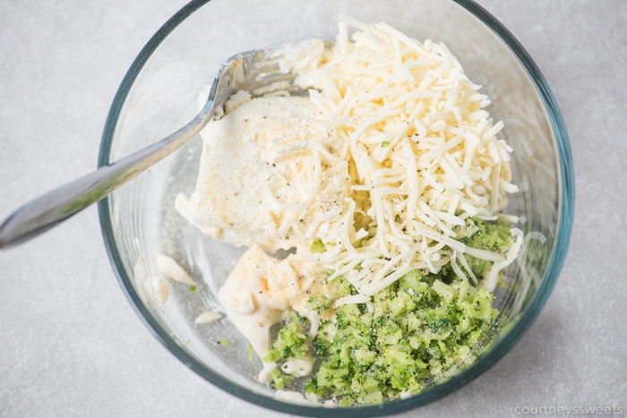 ingredients for broccoli and cheese stuffed chicken in a bowl