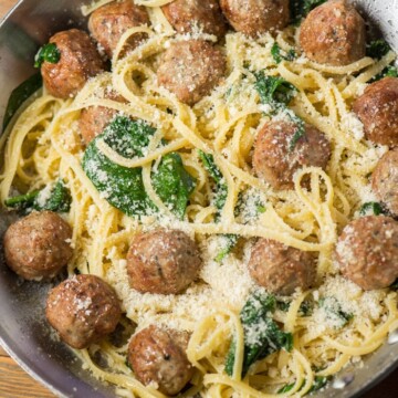 garlic and olive oil pasta with meatballs and spinach