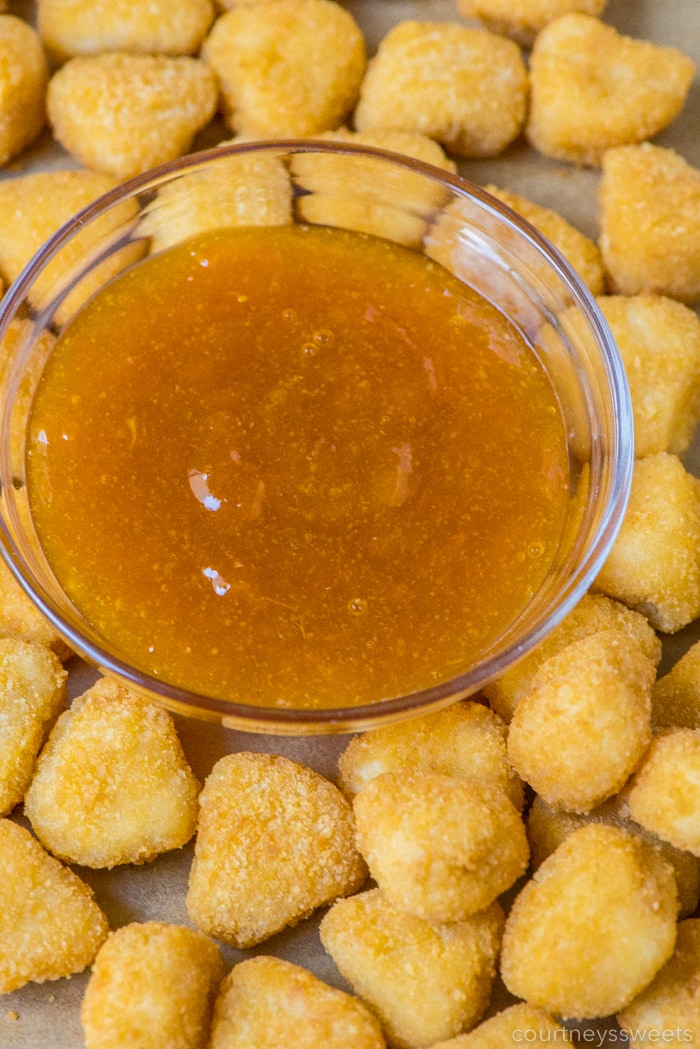 sweet and sour sauce in a bowl with mini chicken nuggets