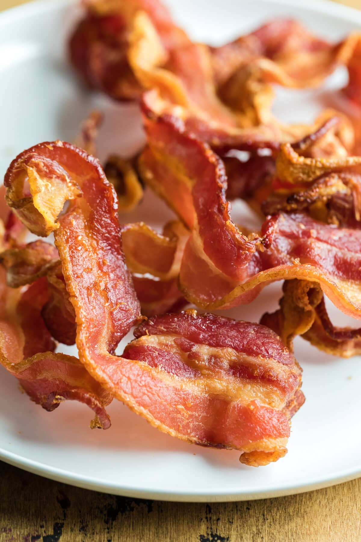 crispy air fryer bacon on a white plate