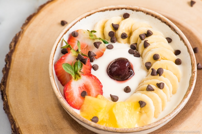 banana split yogurt in a small ceramic bowl