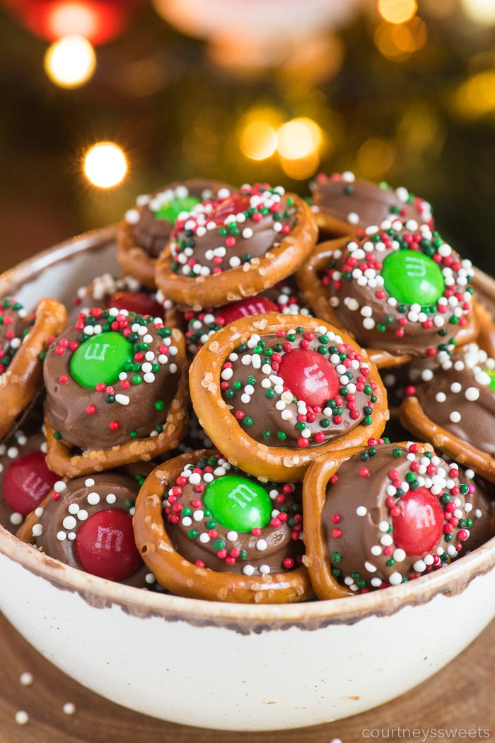 rolo pretzles with m&ms and sprinkles in a bowl