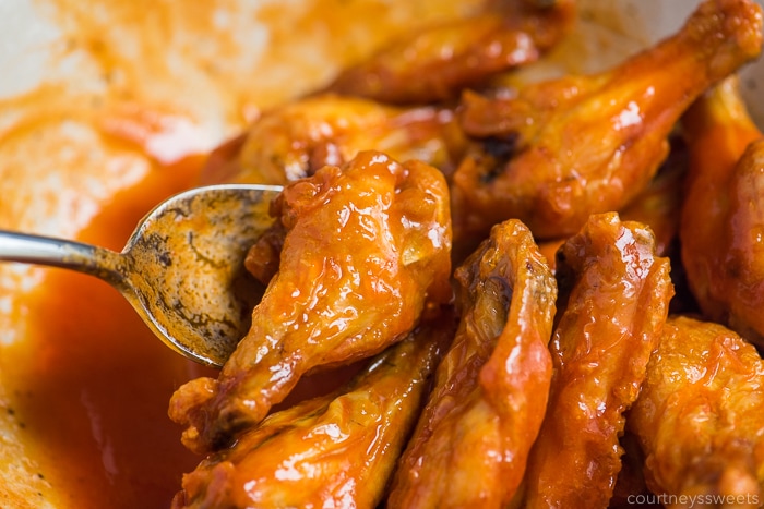 tossing air fryer chicken wings in hot sauce