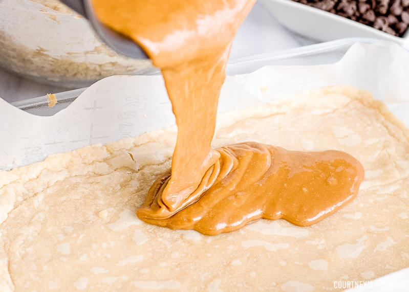 melted caramel pouring onto shortbread crust