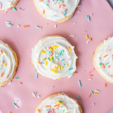 white cake mix cookies with vanilla frosting and rainbow sprinkles