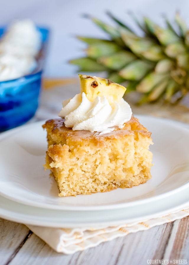 pineapple poke cake slice on a plate