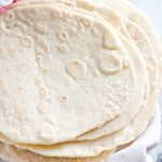 homemade flour tortillas on a clean cloth