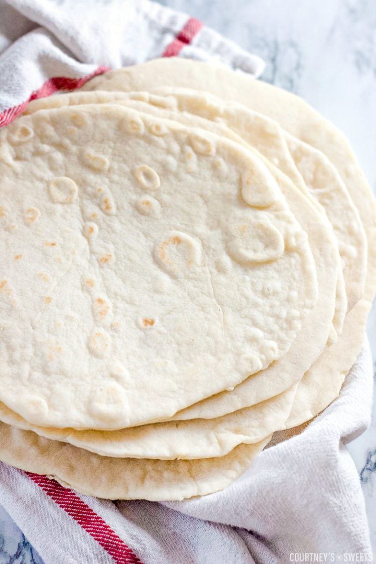 homemade flour tortillas on a clean cloth