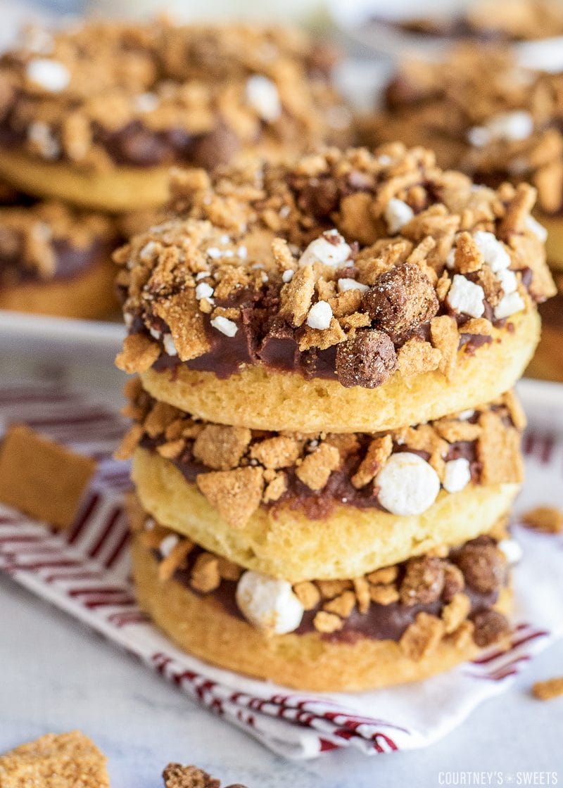 stacked smores donuts on a baking rack