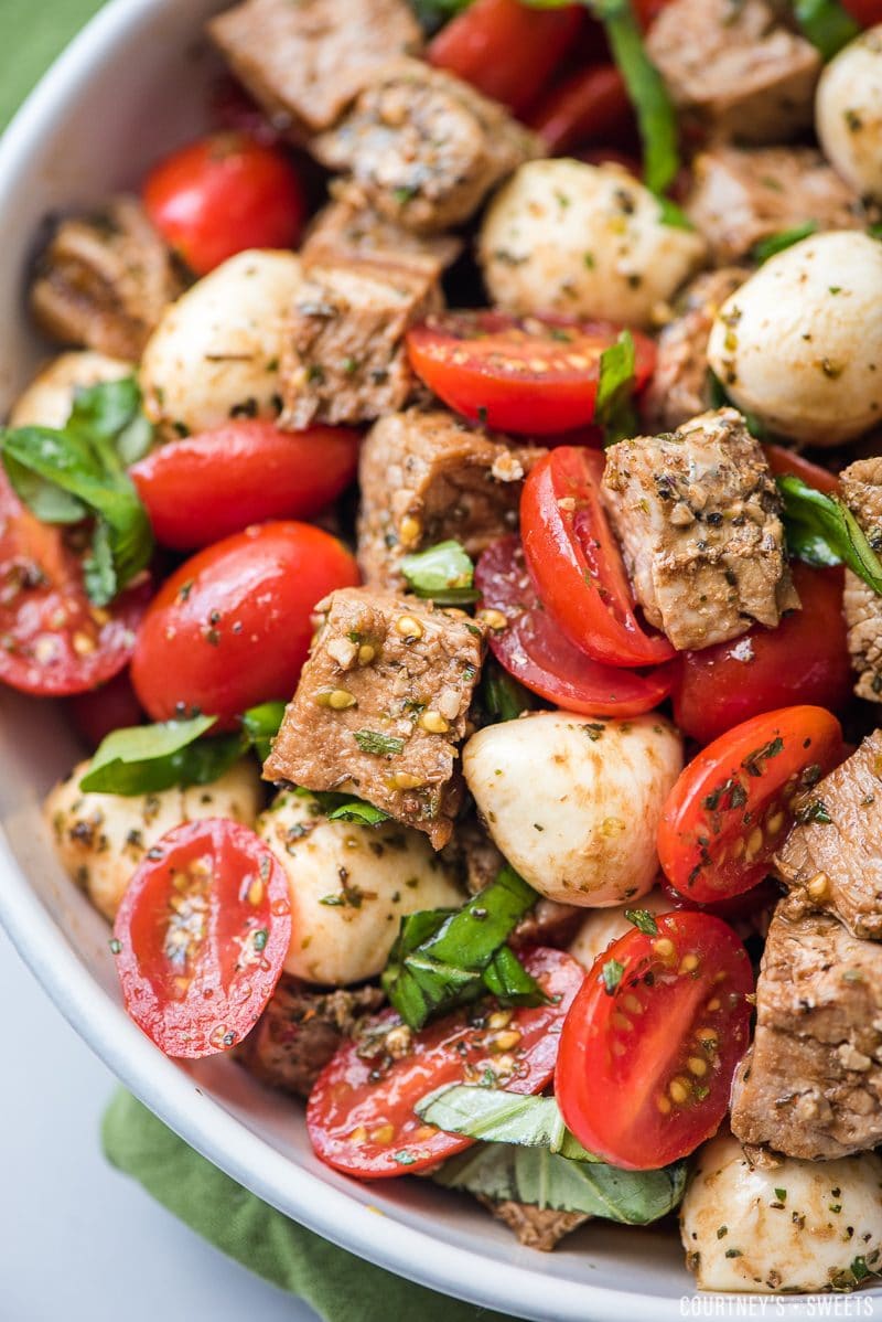 pork caprese salad in a bowl